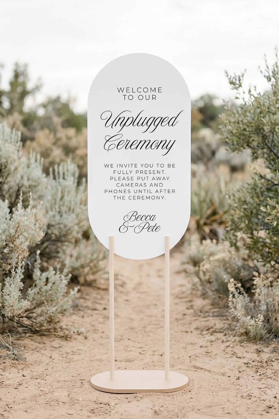 Oval unplugged ceremony sign on a wood stand in a lavender garden #shape_Oval#size_Signature