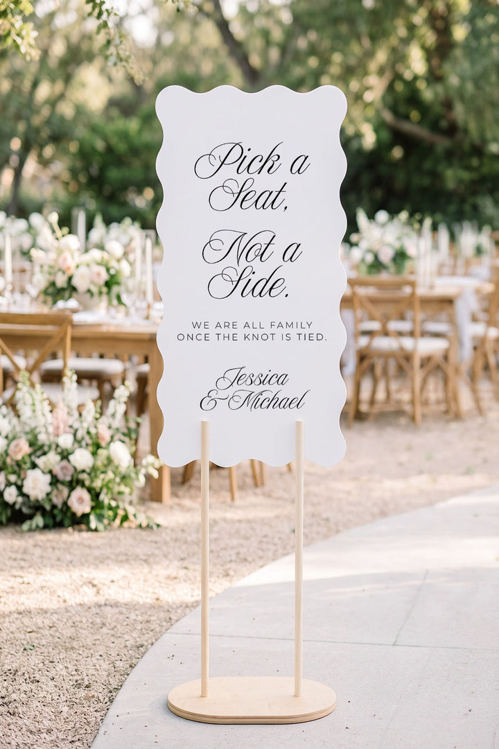 Wavy pick a seat sign at a garden ceremony entrance with olive trees #shape_Wavy#size_Signature