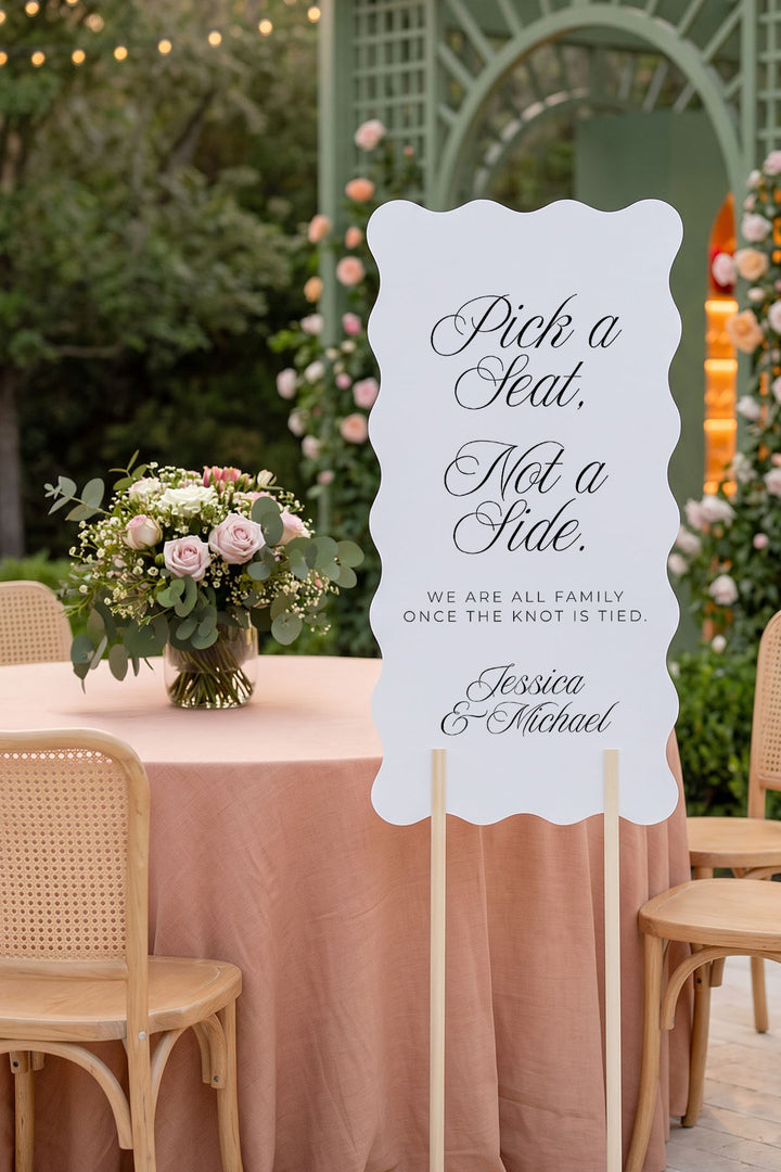Wavy pick a seat sign with floral reception table and garden arch #shape_Wavy#size_Signature