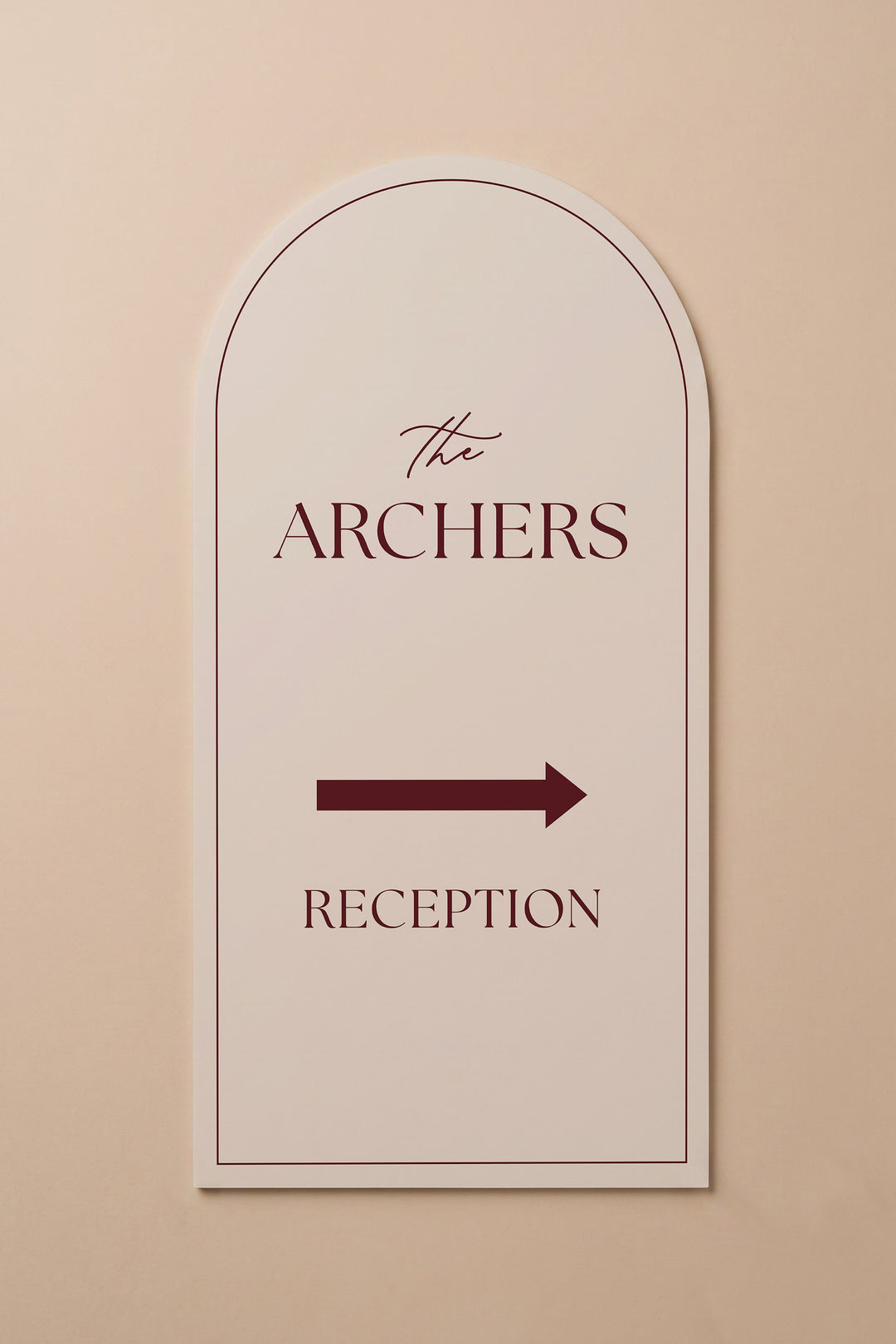 Linen off white arch reception directional sign shown flat against a warm neutral wall #color_Linen