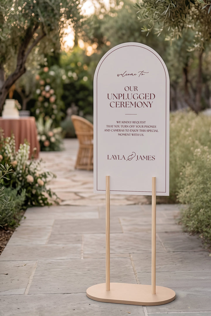 Linen off white arch unplugged ceremony sign on a stone terrace at golden hour #color_Linen
