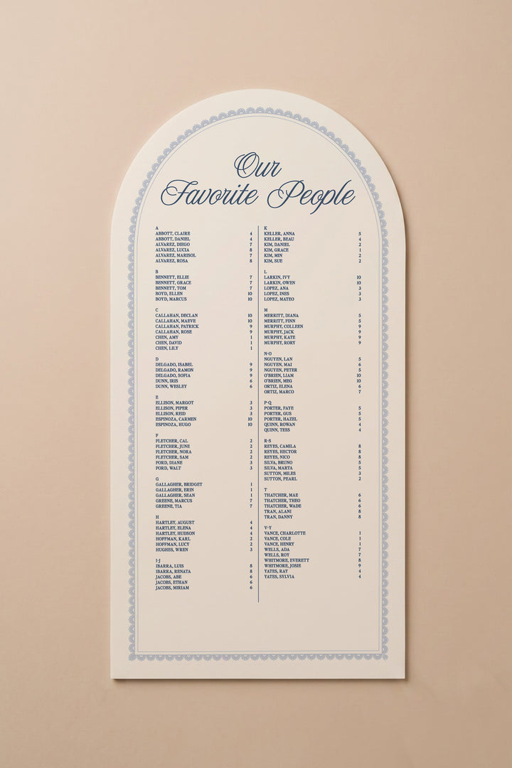 French navy arch wedding seating chart with a lace border, guests listed A to Z with table numbers #shape_Arch#color_French Navy