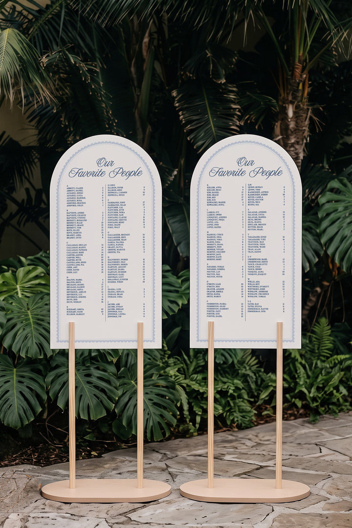 Two panel French navy arch wedding seating chart on matching stands, guests A to Z with table numbers #shape_Arch#color_French Navy
