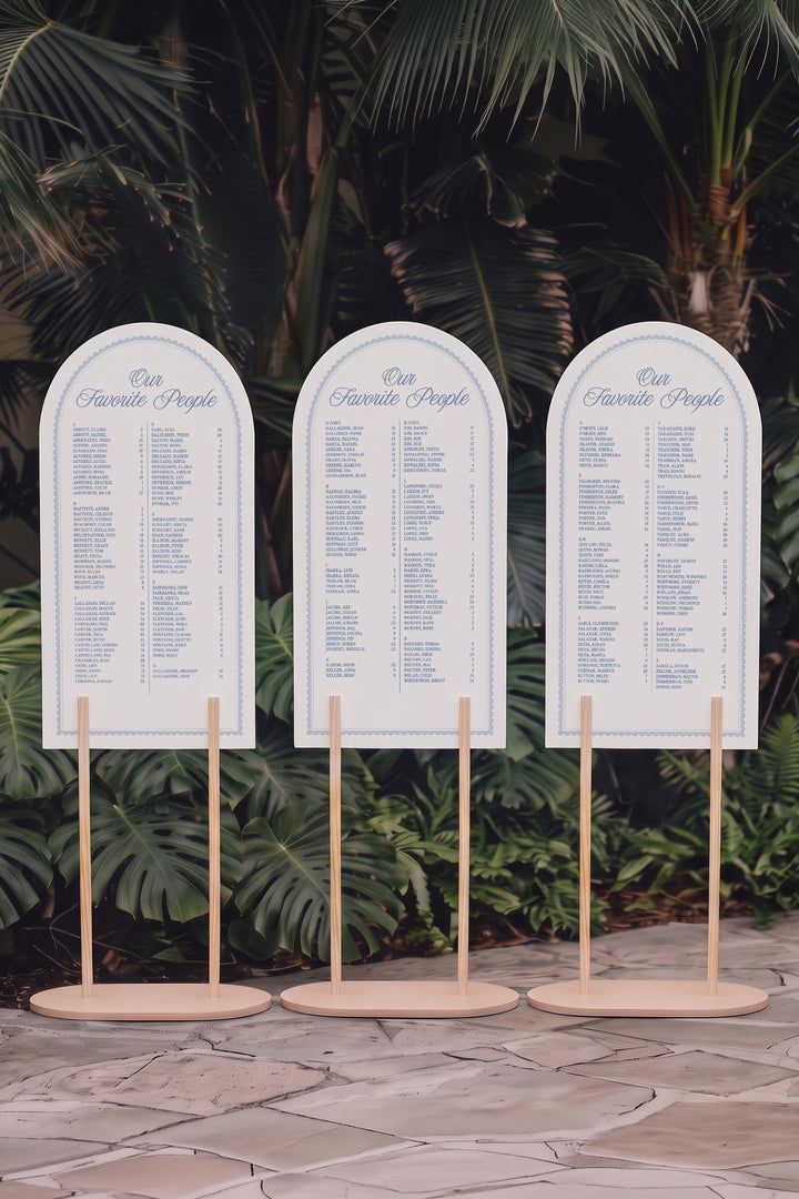Three panel Powder blue arch wedding seating chart on matching stands, guests A to Z with table numbers #shape_Arch#color_Powder