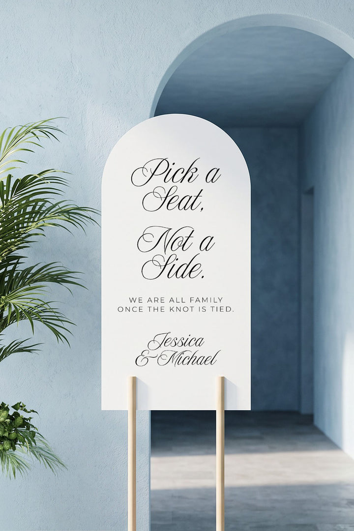 Arch pick a seat not a side sign on a wood stand in a blue arched alcove #shape_Arch#size_Signature