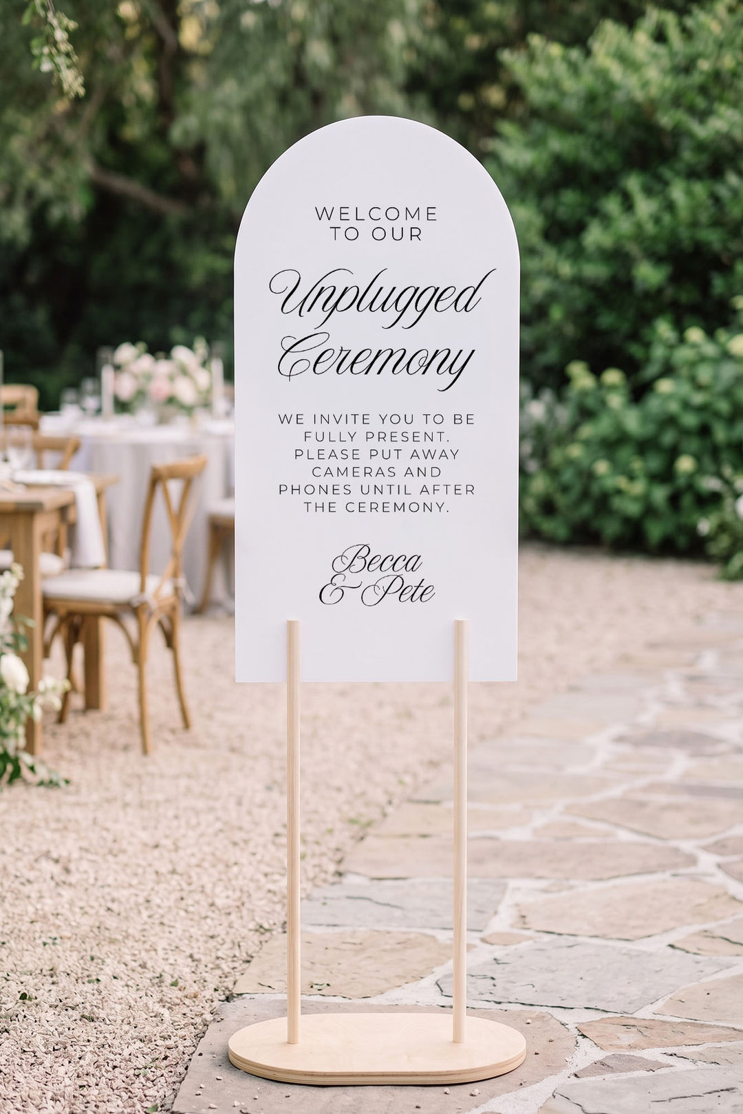 Arch unplugged ceremony sign at a garden reception with crossback chairs #shape_Arch#size_Signature