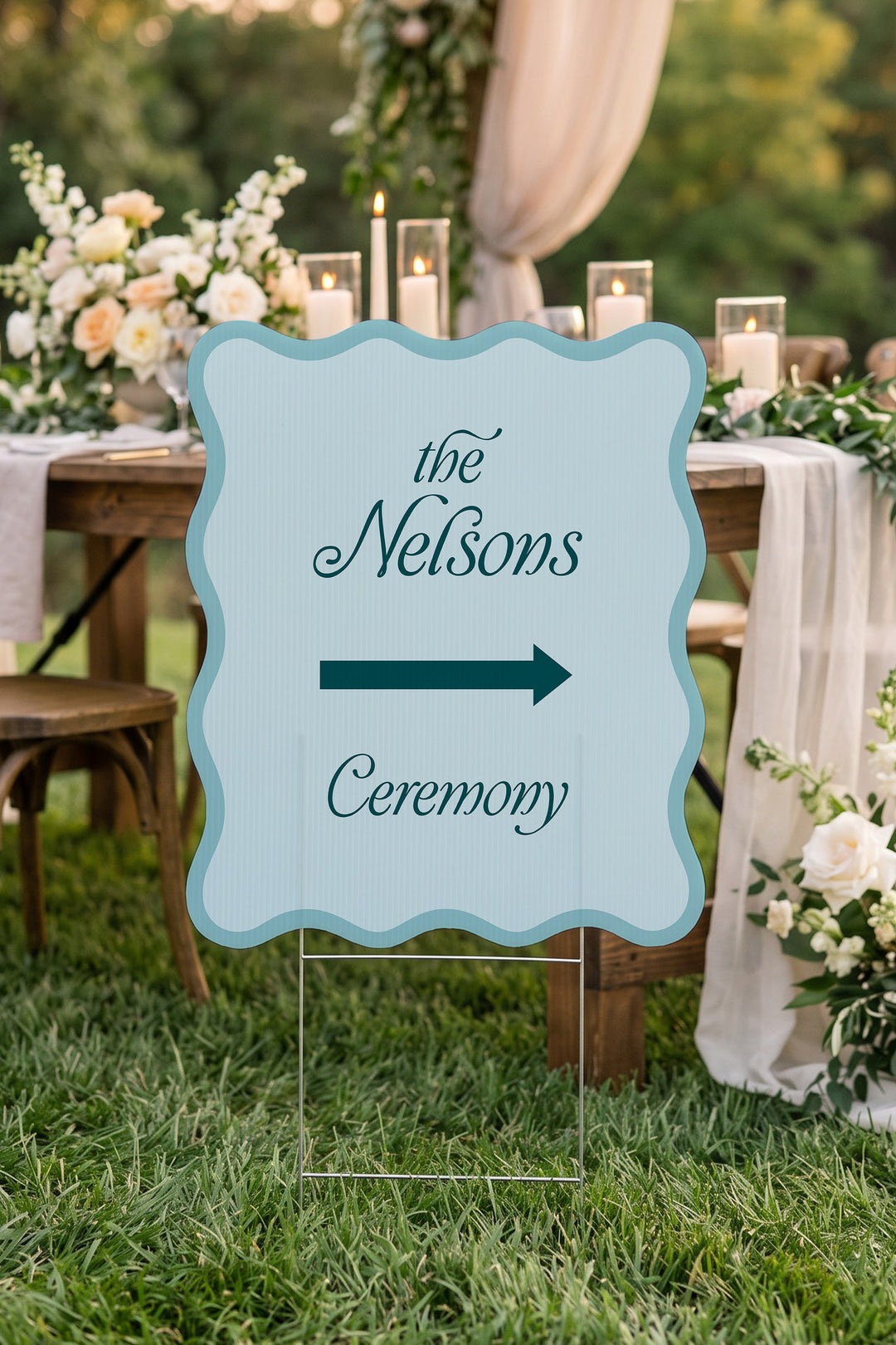 Salt Air blue wavy wedding directional yard sign beside a candlelit reception table #Color_Salt Air