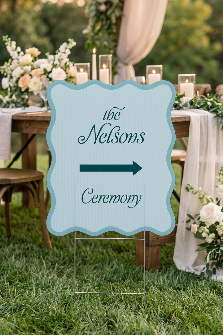 Salt Air blue wavy wedding directional yard sign beside a candlelit reception table #Color_Salt Air