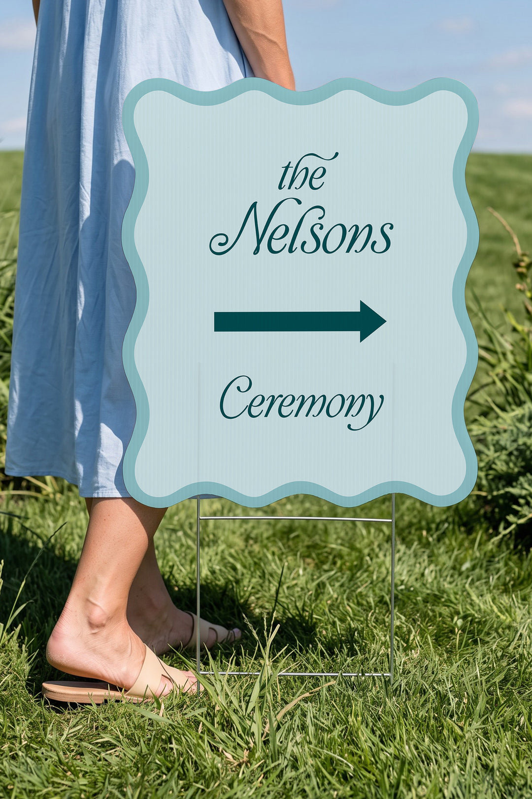 Salt Air blue wavy wedding directional yard sign held beside a guest for scale #Color_Salt Air
