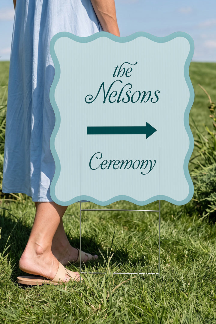 Salt Air blue wavy wedding directional yard sign held beside a guest for scale #Color_Salt Air