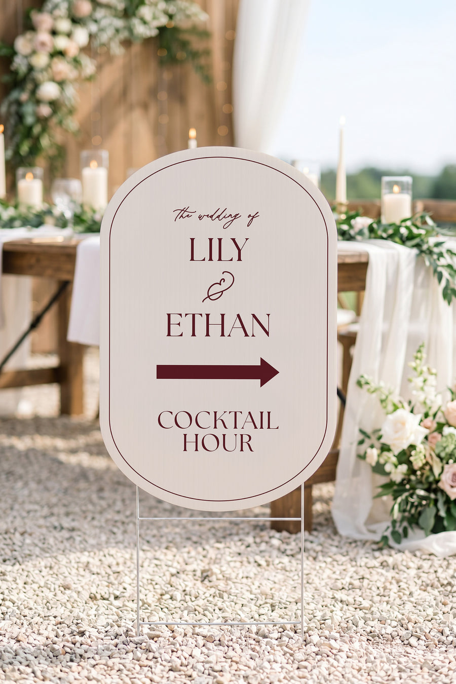 Linen off white pill wedding directional yard sign on gravel beside a candlelit reception table #Color_Linen