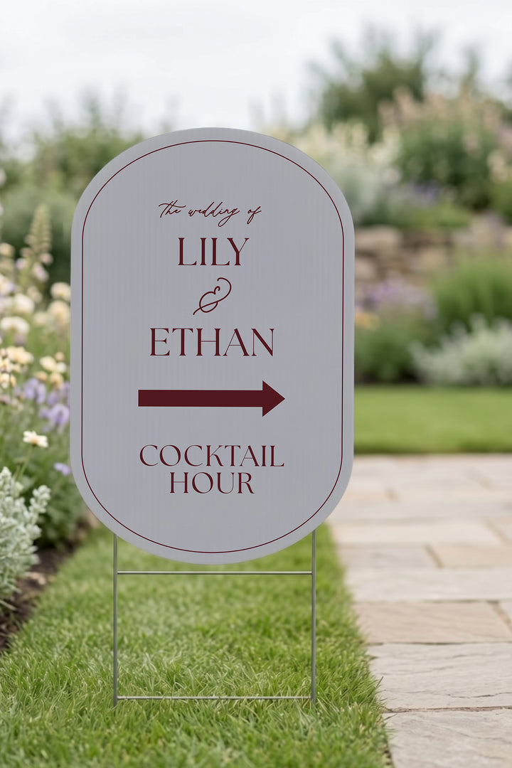 Pewter grey pill wedding directional yard sign staked in a lawn beside a stone path #Color_Pewter