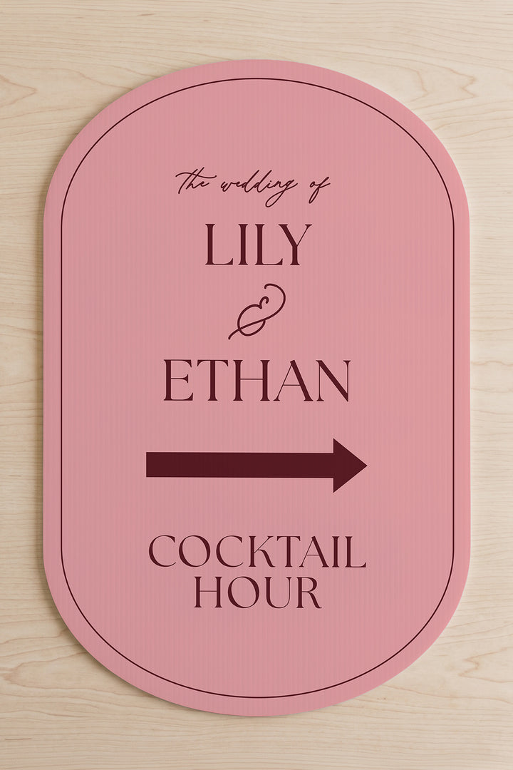 Rosé pink pill wedding directional yard sign shown flat, the couple's names above the arrow #Color_Rosé
