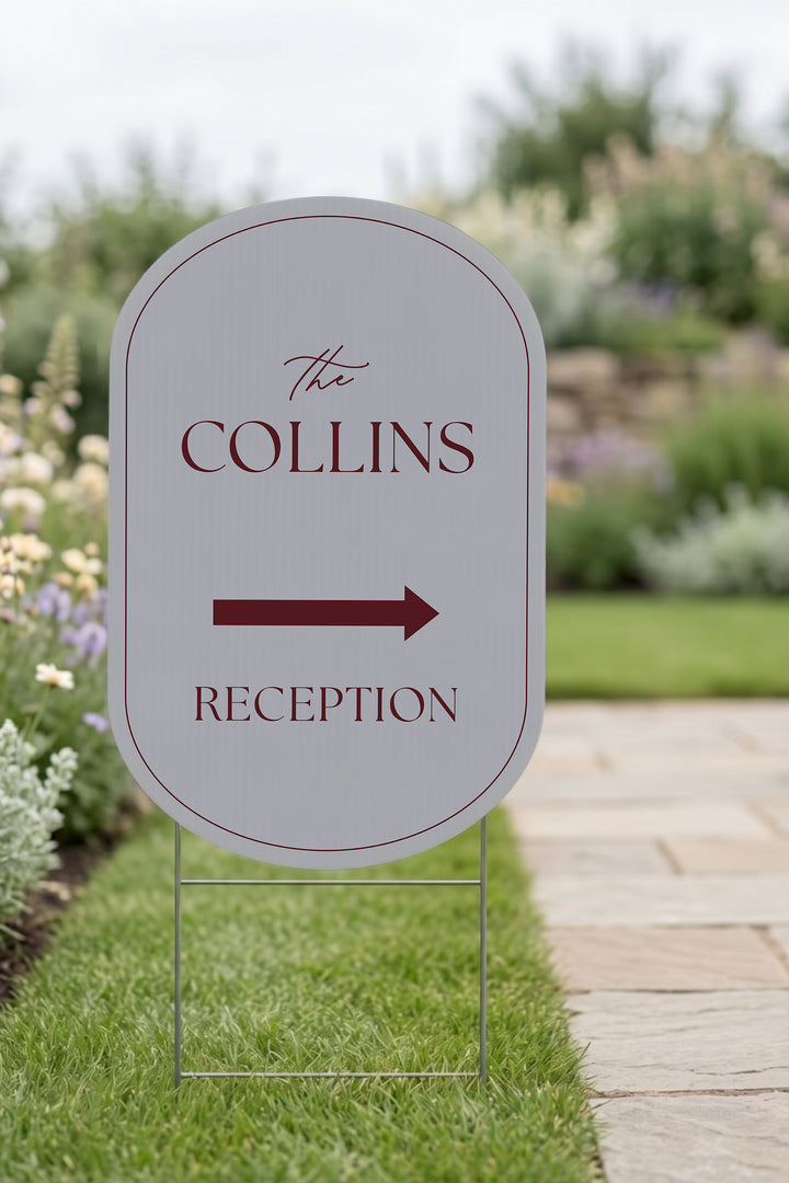 Pewter grey pill wedding directional yard sign staked in a lawn beside a stone path #Color_Pewter