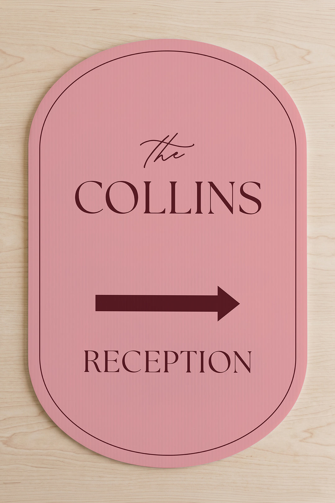 Rosé pink pill wedding directional yard sign shown flat, the family name above the arrow #Color_Rosé