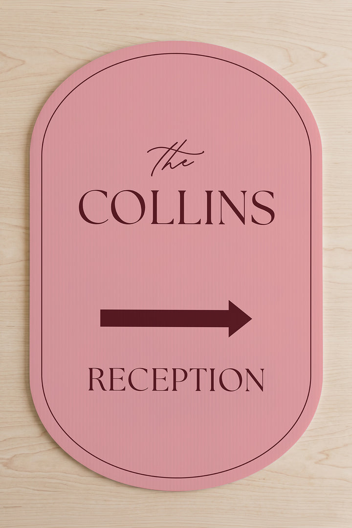 Rosé pink pill wedding directional yard sign shown flat, the family name above the arrow #Color_Rosé